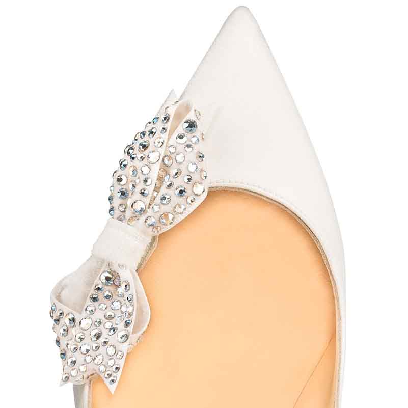 Pointed toe high heel pump with rhinestone bow embellishment